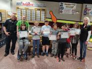 Children receiving certificates for helping as school safety patrol at Jeferson Elementary as crossing guards.