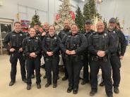 A photo of the Richland Center WI Police Officers at the Shop with a Cop event at Wal-Mart.